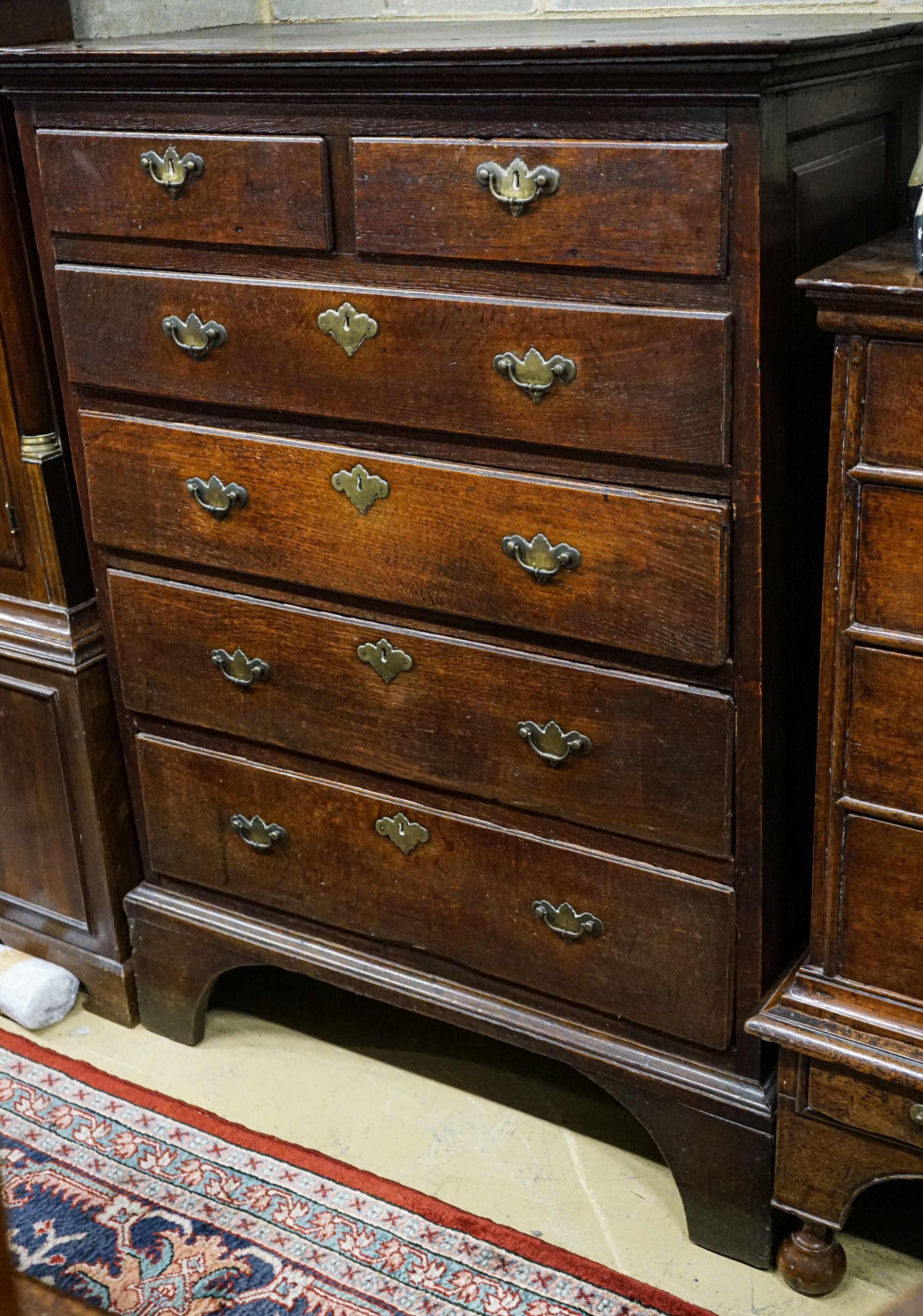 An early 19th century mahogany banded oak cased eight day longcase clock, height 227cm